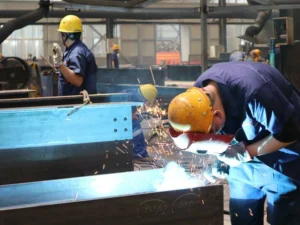 What Is the Full Manufacturing Workflow of Heavy Industrial Steel Structures—from Design to Shipment?